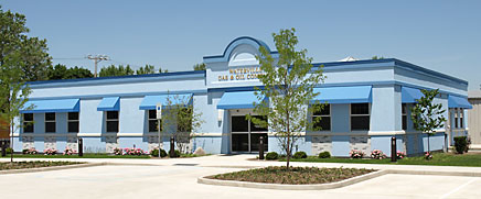 Waterville Gas Building - blue building with trees out front.